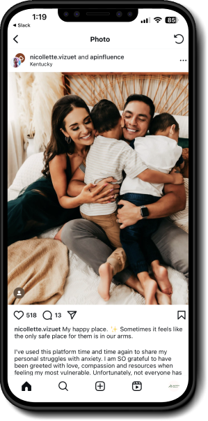 Image of a phone with the El Beacon website on the screen.