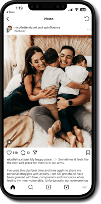 Image of a phone with the El Beacon website on the screen.